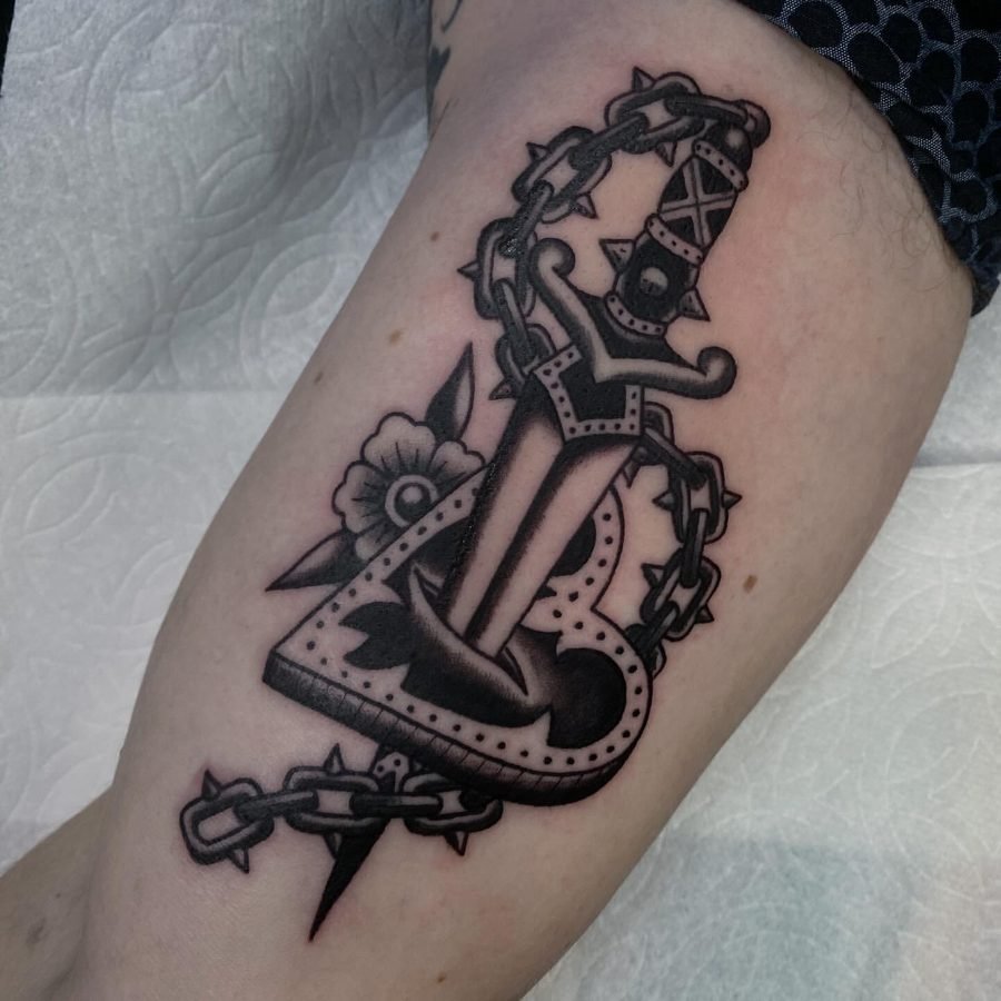 Anchor tattoo with spiked chain detail
