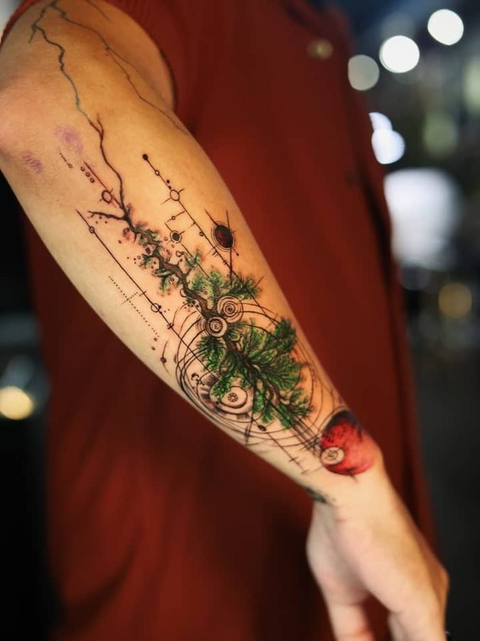 Geometric tree tattoo with circuit-line detail