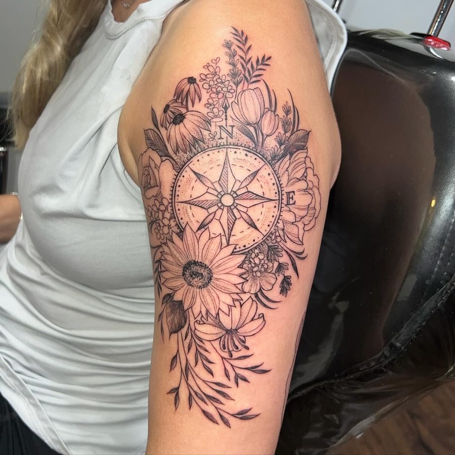 Floral half sleeve with compass centerpiece