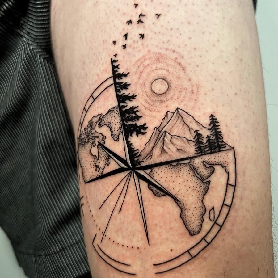 Globe, mountain, and birds compass tattoo