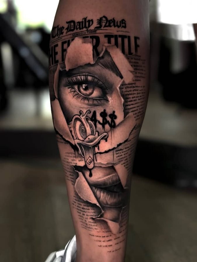 Surreal newspaper, eye, and duck calf piece