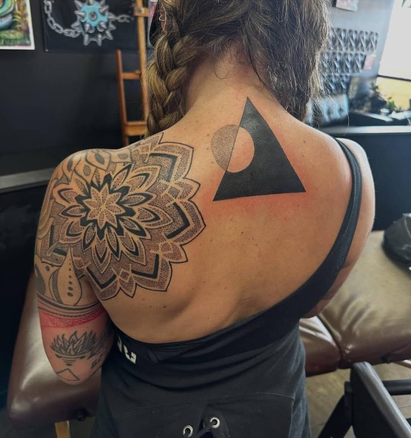 Shoulder mandala tattoo shown from the back