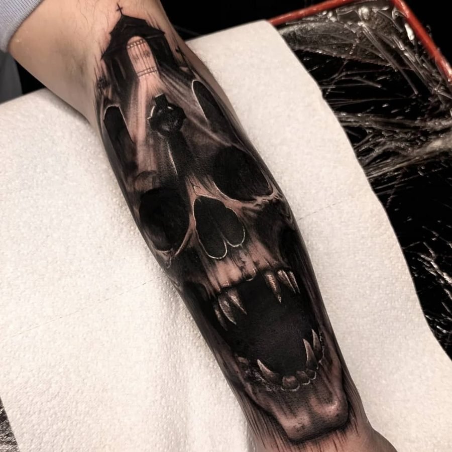 Gothic vampire skull tattoo on forearm